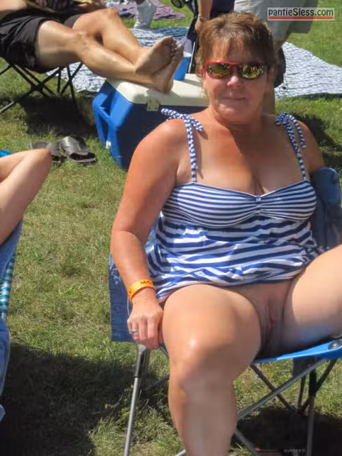 Exposed and Unashamed: Mature Brunette Flashes Her Hairy Pussy at the Campsite