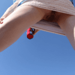 Careless wife lets voyeurs to see her panties in park