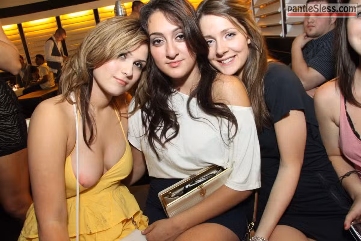 Teen girl in yellow unintentional boob slip on group photo