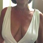 Naughty wife accidently exposes tan boobs at party