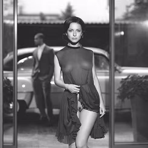 Sexy babe in black transparent dress