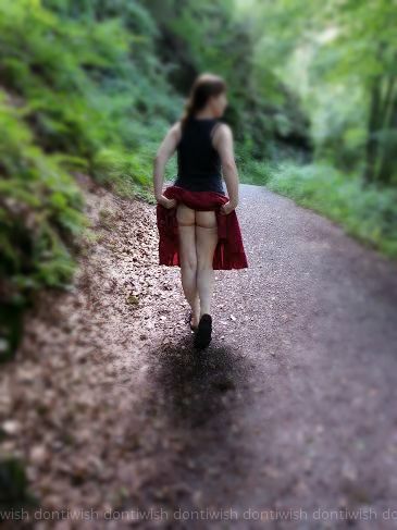 a girl walks with a naked ass