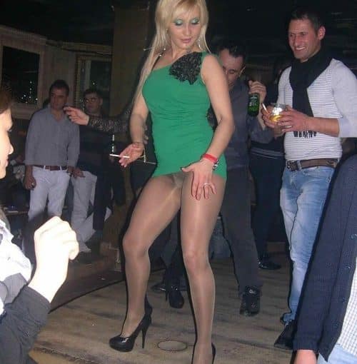 blonde is dancing and lifted her dress