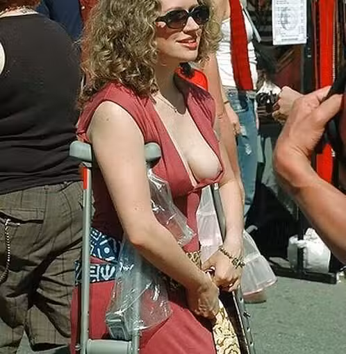 curly haired woman flashed a tit
