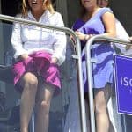 Bare ass blonde in very short black skirt walking black dog out