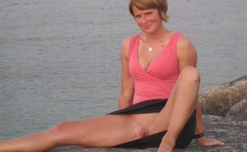 kinky mom shows shaved pussy on the beach