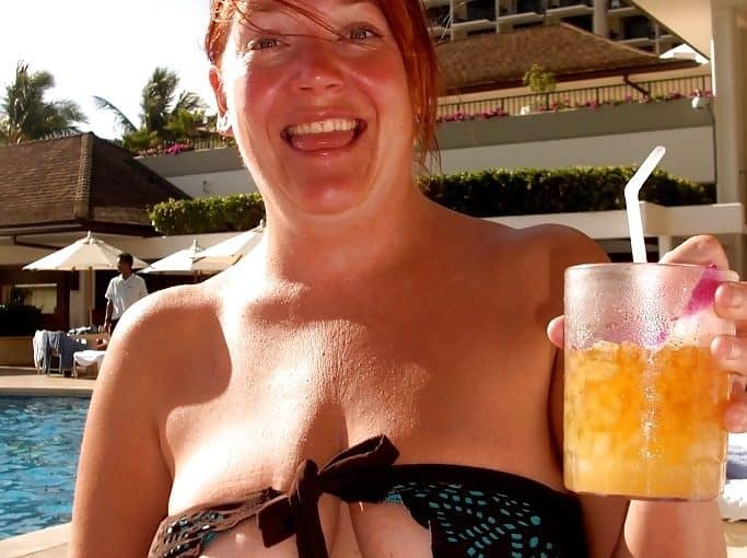 mature lady flashed her tits by the pool