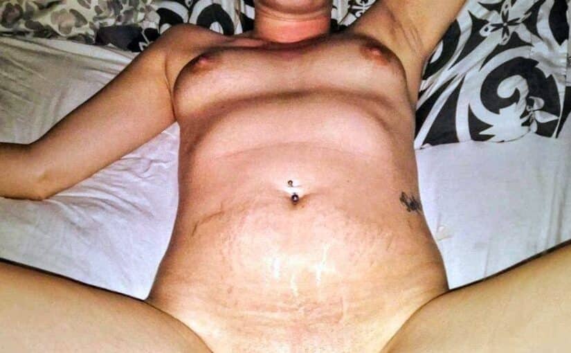 Mature MILF Flashes Her Shaved Pussy on a Sunny Beach Day