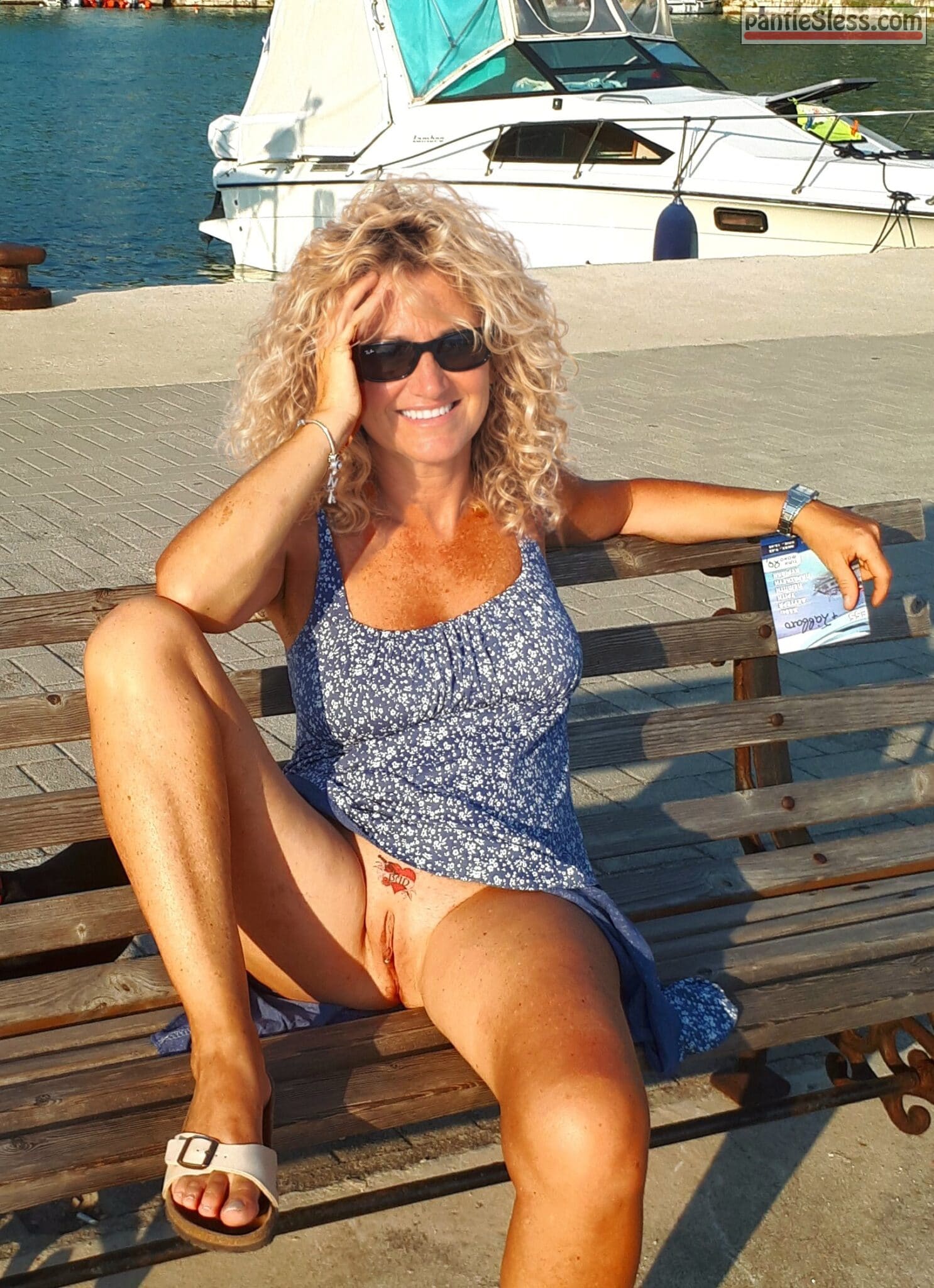 voyeur upskirt shaved pussy pussy flash public flashing nudes milf mature hotwife bottomless blonde babes ass flash accidental flash  Blonde Babe Flashes Her Pussy on Dockside Bench